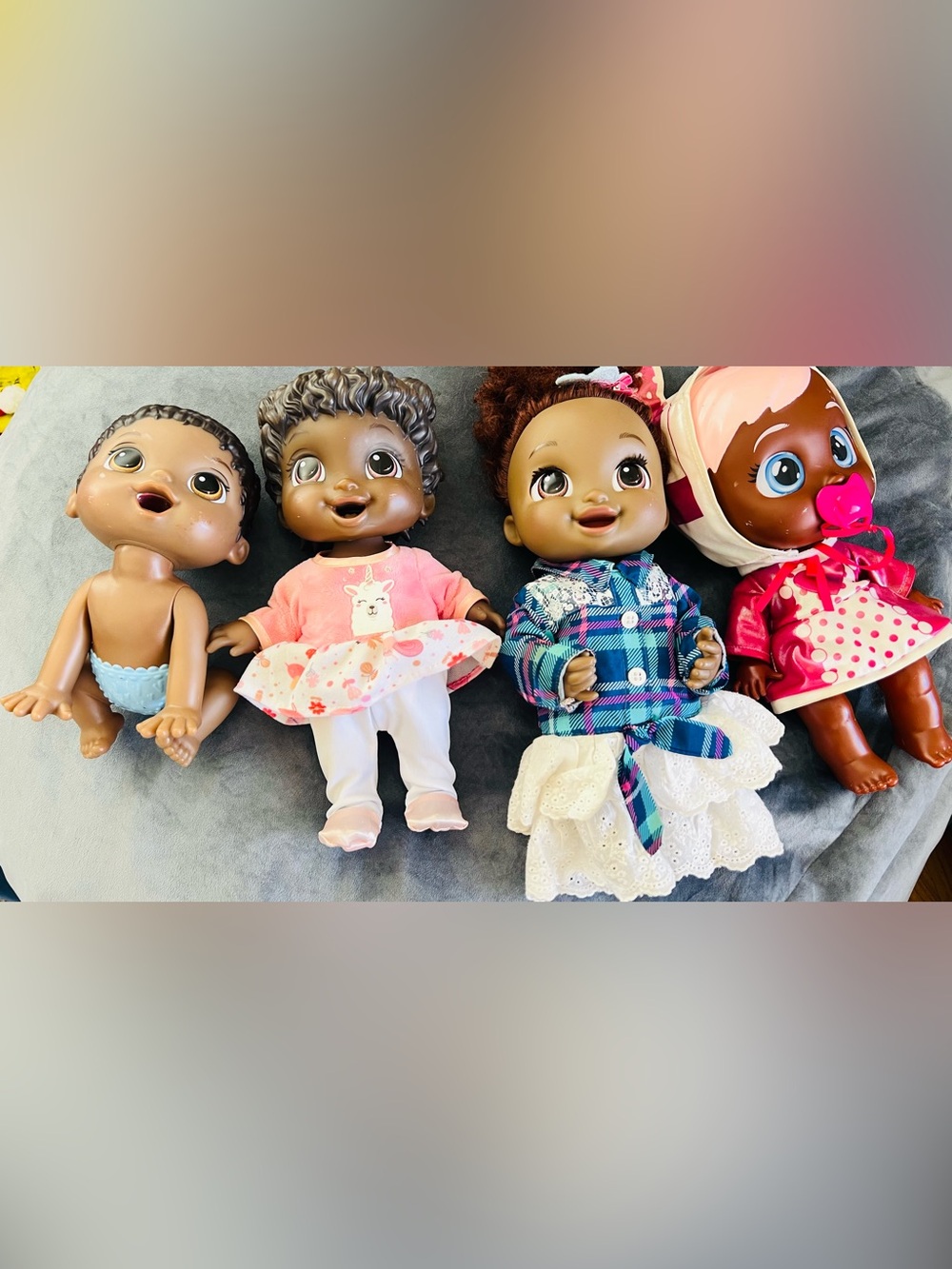 4 Assorted Baby Dolls Set - Brown Skin Dolls in Pink, Blue and Plaid Outfits